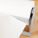 A Bulman steel paper dispenser holding a roll of paper towels.