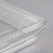 A Durable Packaging silver aluminum foil container with a dome lid and plastic handles.
