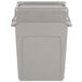 A beige Rubbermaid rectangular plastic trash can with a beige lid.