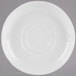 A white porcelain saucer with a circular pattern.