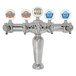 A Micro Matic chrome beer tap tower with 5 medallions above different colored beer labels.
