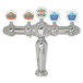 A Micro Matic chrome Brigitte 5 tap tower with medallions displaying different colored labels.