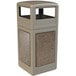 A beige rectangular trash can with square and riverstone panels on the top and a dome lid.