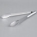 Two Rubbermaid stainless steel tongs with white handles.