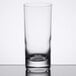 A close-up of a clear Reserve by Libbey Modernist Beverage Glass on a table.