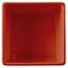 A red square Tablecraft contemporary copper bowl with a white border.