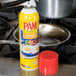 A yellow can of PAM Buttercoat Release Spray sitting on a counter next to a pan.