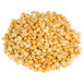A pile of dried yellow split peas on a white background.