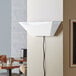 A white Lavex Zap N Trap wall sconce on a wall.