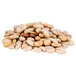 A pile of organic dried pinto beans on a white background.