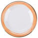 A close up of a Kanello white melamine plate with a wide white rim and an orange edge.