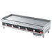 A large rectangular Vollrath countertop gas griddle with manual controls and four burners.