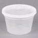 A white plastic container with a round lid.