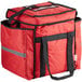 A red ServIt insulated food delivery bag with black straps.