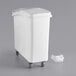 A white plastic Baker's Mark ingredient storage bin with wheels and a sliding lid.