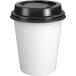 A white Choice paper hot cup with a black lid.