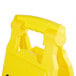 A yellow plastic Rubbermaid Double Sided Caution Wet Floor sign with a handle.