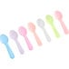 A row of Choice neon plastic taster spoons in assorted colors.