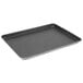A black Vollrath Wear-Ever rectangular baking tray with a wire in rim.