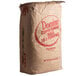 A large brown bag of Domino confectioners sugar with red text.