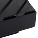 A close up of a black rubber square.