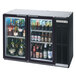 A black Beverage-Air back bar refrigerator filled with bottles of beer.