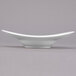 A white porcelain bowl with a curved edge.