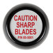 A black and white circular knob with red text that reads "caution sharp blades" on it.