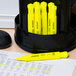 A yellow Universal desk style highlighter with black text.