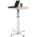 A Luxor pneumatic adjustable height table with a laptop on it.