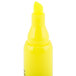 A yellow Universal desk style highlighter with a chisel tip and white cap.
