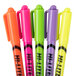 A group of Avery Hi-Liter markers in neon colors including green, pink, purple, and yellow.