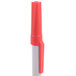 The white tip of a Universal red ballpoint pen.