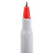 A white Universal ballpoint pen with a red tip.