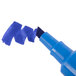 The chisel tip of a blue Avery Marks-A-Lot permanent marker on a white background.