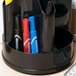 A black pen holder on a counter with Avery Marks-A-Lot permanent markers in red, blue, and black.