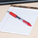 Universal One UNV39914 Red Medium Point 0.7mm Clear Retractable Rollerball Gel Pen - 12/Pack Main Thumbnail 1