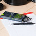 Universal One UNV15520 Comfort Grip Black Fine Point 0.7mm Retractable Ballpoint Pen - 12/Pack Main Thumbnail 1
