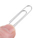 A person holding a Universal silver jumbo paper clip.