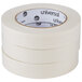 A roll of Universal white general purpose masking tape with black text on the label.