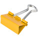 A yellow Universal assorted color binder clip with a handle.