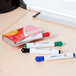 A box of Universal Bullet Tip Desk Style Dry Erase Markers on a table.