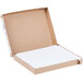A cardboard box with a white cover and white paper inside.