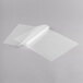 A white sheet of paper on a gray surface.