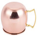 An American Metalcraft mirrored copper Moscow Mule mug with a gold handle.