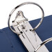 A close-up of a Universal Royal Blue ring binder with metal rings.