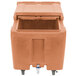 A brown plastic Cambro mobile ice bin with a sliding lid.