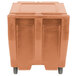A Cambro coffee beige plastic container with sliding lid on wheels.