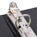 A close-up of a black Universal Deluxe Non-Stick View Binder with metal clasp on the front.