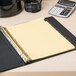 A binder with Universal Leather-Look Month Tab Dividers on it.